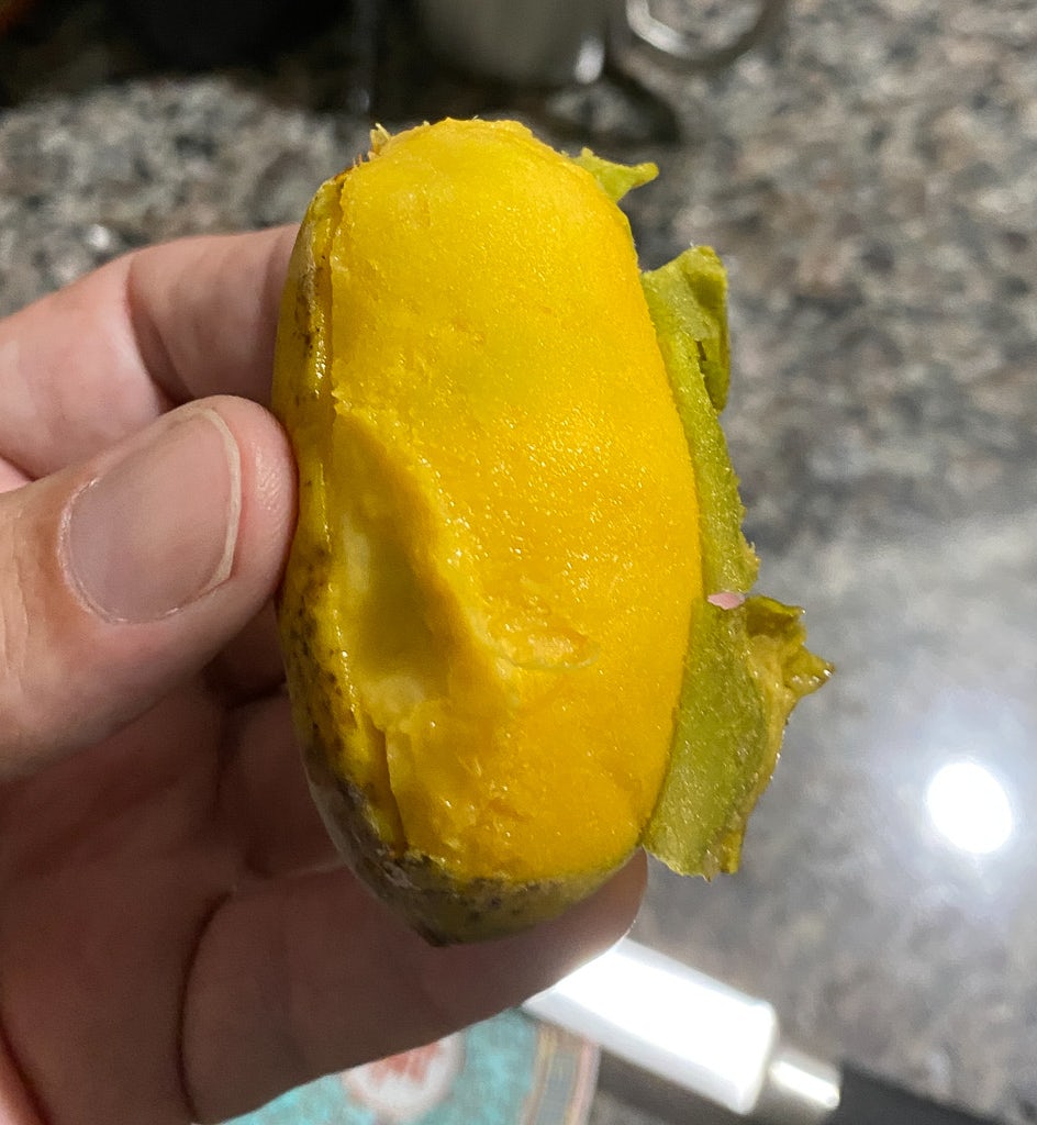 I chilled the Pawpaw in the refrigerator for a few hours before eating it. It tasted like a very lightly-flavored banana ice cream. 20230808 Img 7176